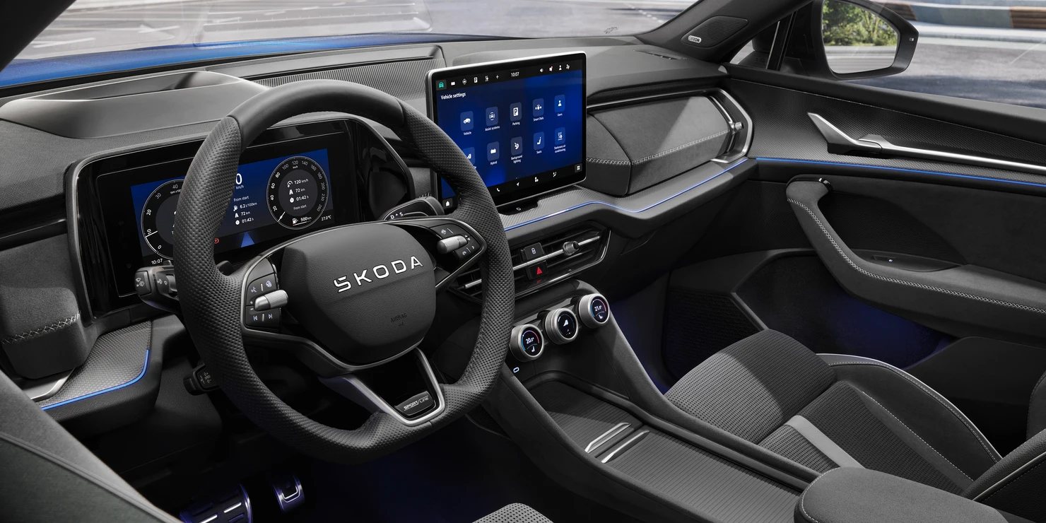The Sportline-badged three-spoke multifunction steering wheel gives the interior an authentic racing feel.