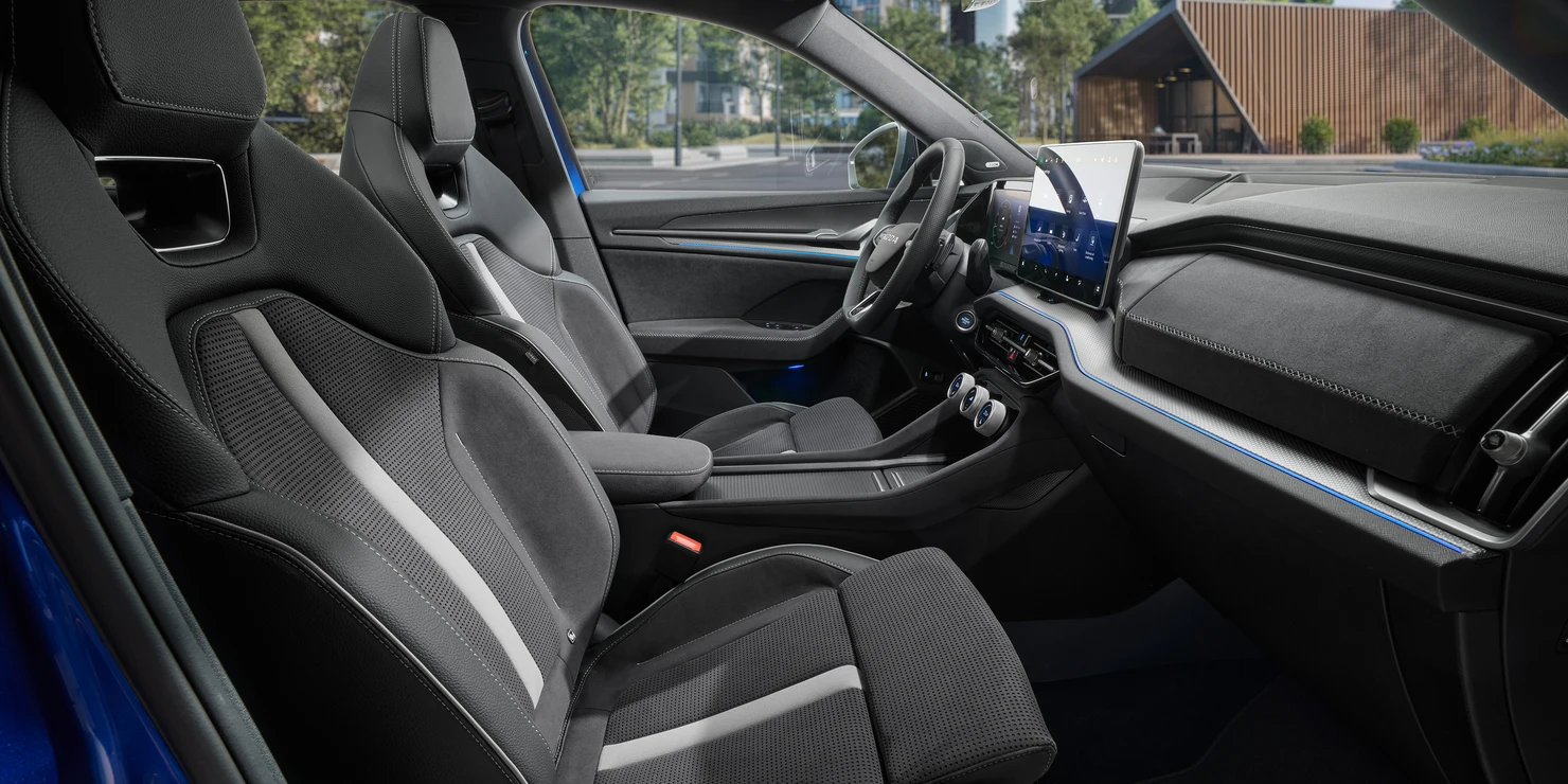 Electrically adjustable lumbar-support sports seats and a fixed head restraint keep you steady in the sharpest curves.